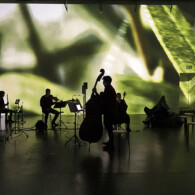 Titel: makropolis - Performance Konzert Installation. Konzept, Raum, Text, Musik, Video und Regie: Joerg Laue. Kuenstl. Mitarbeit und Kostuem: Nina DeLudemann. Bildregie: Florian Fischer. Klangregie: Mattef Kuhlmey. Licht: Fabian Bleisch. Koproduktion Lose Combo und dem Ensemble KNM und KINDL. Ort: KINDL - Zentrum fuer zeitgenoessische Kunst, Maschinenhaus. Urauffuehrung: 18. Januar 2023. no model release. SpielerInnen: Claudia Splitt und Florian Feigl / Performance; Ensemble KNM: Rebecca Lenton / Floete, Carol Mc Donnel / Klarinette, Peng-Hui Wang / Fagott, Jack Adler-McKean / Tuba, Theodor Flendell / Violine, Cosima Gerhardtt / Cello und Jonathan Heilbronn / Kontrabass u.a..
Engl: theatre, music, actor, performer
copyright: david baltzer / bildbuehne.de